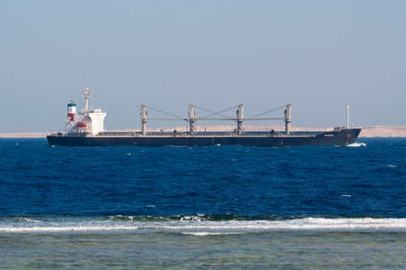 Sharm El Sheikh, Egypt - November 21, 2010: Bulk Carrier Valopoula sails along the shore of the Red Sea near Sharm El Sheikh, Egypt at November 21, 2010. Type of vessel: Bulk Carrier. Flag: Bahamas.のeditorial素材