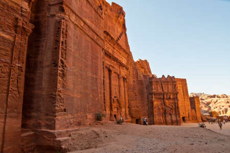 Petra, Jordan - November 20, 2010: Tourists walk in one of the Seven Wonders of the World - Red city of Petra in Jordan. Petra has been a UNESCO World Heritage Site since 1985のeditorial素材
