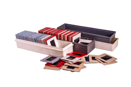 35 mm mounted film slides into the plastic and cardboard different colored frames and plastic boxes isolated on white background, cliping path embeddedの写真素材