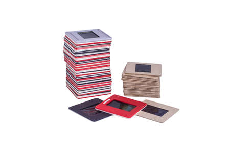 35 mm mounted film slides into the plastic and cardboard different colored frames isolated on white...