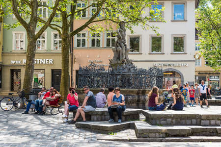 Bamberg, Germany - May 22, 2016: Tourists and local near the fountain with a statue of Neptune on Greenmarket Square. Bamberg is under UNESCO protection.のeditorial素材