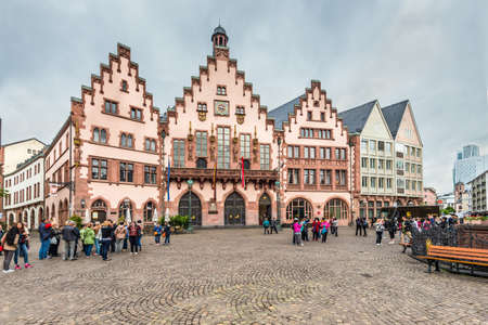 Frankfurt am Main, Germany - May 23, 2016: Tourists on the Romerberg Square on a cloudy rainy weather in Frankfurt am Main, Germany, Hesse, Germany.のeditorial素材