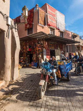 Marrakesh, Morocco - December 8, 2016: People, transport and shops in the famous souks of Marrakesh, Morocco. The traditional Berber market is one of the most important attractions of the city.のeditorial素材