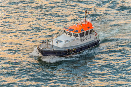 Funchal, Madeira, Portugal - December 10, 2016: Pilot boat expected of going ship to enter the port of Funchal on Madeira Island, Portugal.のeditorial素材