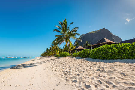 Le Morne, Mauritius - December 11, 2015: Amazing white beaches of Mauritius island. Tropical vacation in Le Morne Beach, Mauritius. Le Morne Brabant mountain in the background.のeditorial素材