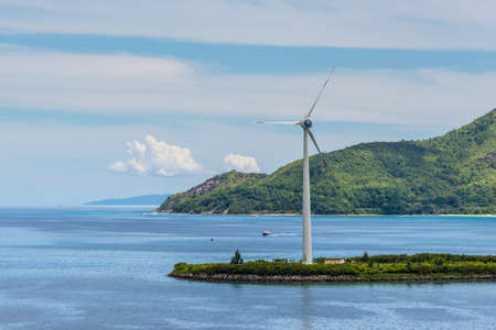 Victoria, Mahe island, Seychelles - December 17, 2015: Wind turbines producing clean electricity in Victoria harbor, Mahe Island, Seychelles.のeditorial素材