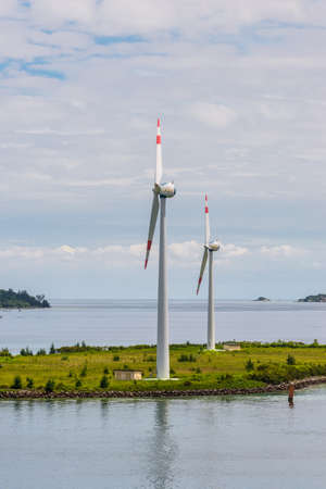 Victoria, Mahe island, Seychelles - December 17, 2015: Wind turbines producing clean electricity in Victoria harbor, Mahe Island, Seychelles, Indian Ocean, East Africa.のeditorial素材