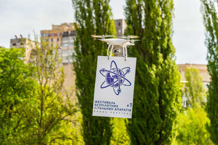 Kyiv, Ukraine - April 29, 2017: Drone quadcopter flies with a poster during the first Drone Festival in Kyiv, Ukraine.のeditorial素材