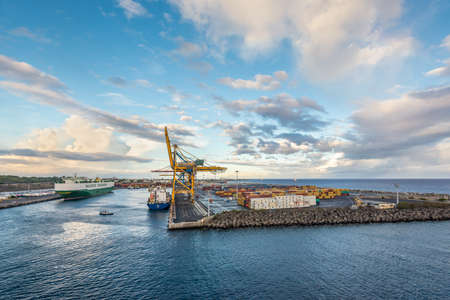 Le Port, Reunion island, France - December 24, 2015: Vehicles Carrier Ship Boheme and General Cargo Ship Kiara at  industrial cargo container port of Reunion island, France.のeditorial素材