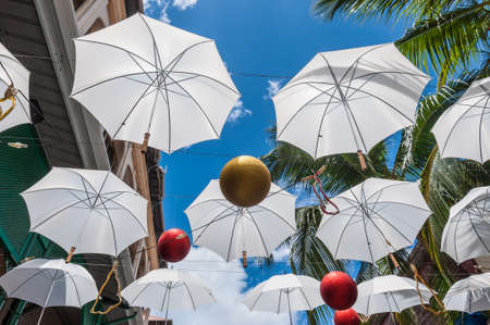 Port Louis, Mauritius - December 25, 2015: Umbrella art display in street at Caudan Waterfront, Port Louis, Mauritius.のeditorial素材