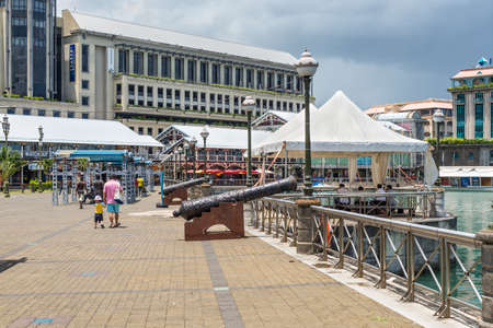 Port Louis, Mauritius - December 25, 2015: Caudon Waterfront at the harbour in Port Louis Mauritius with historical cannon in Port Louis, Mauritius.のeditorial素材