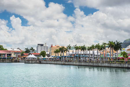 Port Louis, Mauritius - December 25, 2015: Caudan Waterfront pedestrian walkway and harbor in Port Louis, Mauritius.のeditorial素材