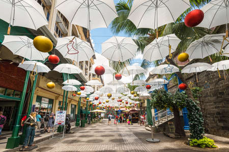 Port Louis, Mauritius - December 25, 2015: Display of white umbrellas in Caudan Waterfront Mall, Port Louis, Mauritius.のeditorial素材