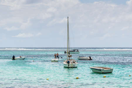 Blue Bay, Mauritius - December 27, 2015: Recreational boats on the Blue Bay Beach, one of the finest beaches in Mauritius and the site of many tourism facilities.のeditorial素材