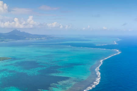 Aerial picture of the southeast, south east coast of Mauritius Island. Beautiful lagoon and reef barrier of Mauritius Island shot from above.の写真素材