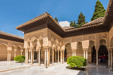 Granada, Spain - May 19, 2014: Tourists in the Court of the Lions in the Alhambra palace in Granada, Spain - masterpiece of moorish architecture (14th century).のeditorial素材