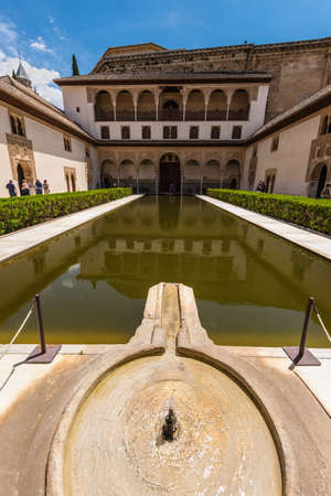 Granada, Spain - May 19, 2014: The courtyard of the Myrtles (Patio de los Arrayanes) in La Alhambra, Granada, Spain. Fountain in the foreground.のeditorial素材