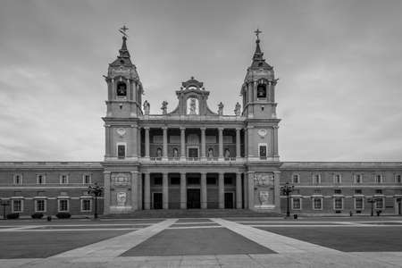 Madrid, Spain - May 22, 2014: Wide-angle view of the Cathedral of Saint Mary the Royal of La Almudena  in cloudy weathe. Madrid is a popular tourist destination of Europe. Black and white retro style.のeditorial素材