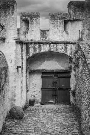 Braubach, Germany - May 23, 2016: Closed gates in the Marksburg castle. It is one of the principal sites of the UNESCO World Heritage Rhine Gorge. Black and white photography.のeditorial素材