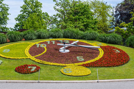 Geneva, Switzerland - May 25, 2016: Iconic outdoor flower clock in an urban park is one of the main attractions of the city and is a symbol of the city's watchmakers.のeditorial素材