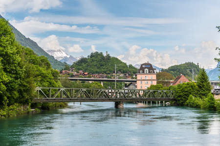 Interlaken, Switzerland - May 26, 2016: View to bridge over Aare (or Aar) river in Interlaken, Switzerland.のeditorial素材