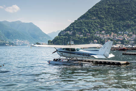 Como, Italy - May 27, 2016: A seaplane of the Aero Club Como docking on at water aerodrome of Como...