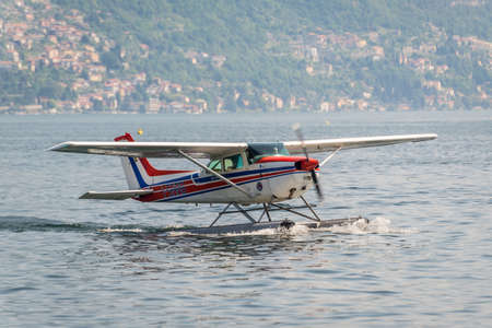 Como, Italy - May 27, 2016: A seaplane of the Aero Club Como taxiing on Como lake in Como City, Italy.のeditorial素材