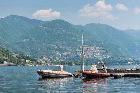 Como, Italy - May 27, 2016: Moored rescue boats on Como lake in Como City, Italy.のeditorial素材