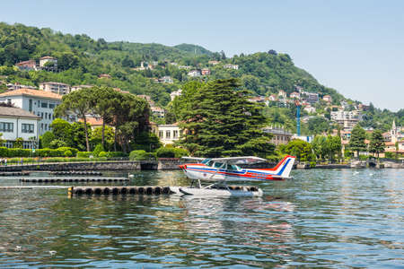 Como, Italy - May 27, 2016: The seaplane Cessna 172N Skyhawk 100 II docking on at water aerodrome of Como lake in Como City, Italy.のeditorial素材