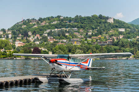Como, Italy - May 27, 2016: A seaplane Cessna 172N Skyhawk 100 II docking on at water aerodrome of Como lake in Como City, Italy.のeditorial素材