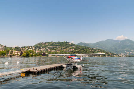 Como, Italy - May 27, 2016: A seaplane of the Aero Club Como docking on at water aerodrome of Como lake in Como City, Italy.のeditorial素材