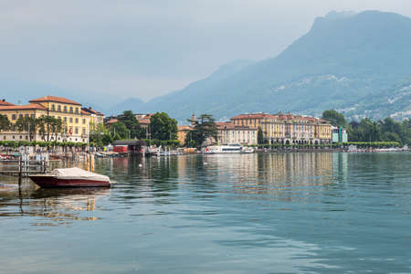 Lugano, Switzerland - May 28, 2016: View of the houses of Lugano with the Lugano lake and a swan - Lake Lugano, Lugano, Ticino, Switzerland, Europe.のeditorial素材
