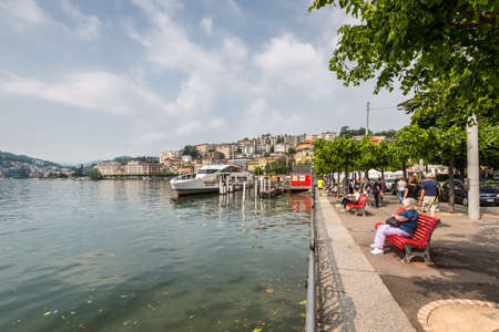Lugano, Switzerland - May 28, 2016: People rest on the Embankmen of Lake Lugano, Lugano,...