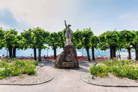 Lugano, Switzerland - May 28, 2016: Sculpture of William Tell at the promenade of the luxurious resort in Lugano on Lake Lugano and Alps mountains in Ticino canton of Switzerland.のeditorial素材