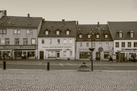Wilsdruff, Germany - May 30, 2016: Old houses on the Market Square of Wilsdruff (Marktplatz), near Dresden, Saxony, Germany. Vintage monochrome sepia toned photography.のeditorial素材