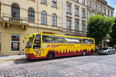 Lviv, Ukraine - May 31, 2016: Lviv Tourist Sightseeing Bus waiting for tourists on the city center of Lviv, Ukraine.のeditorial素材