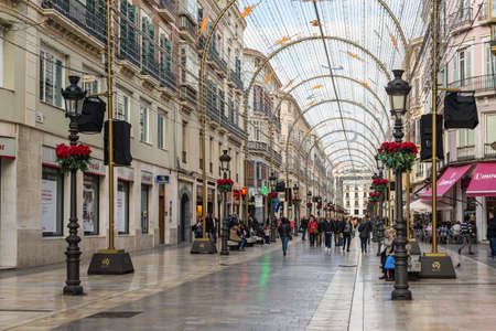 Malaga, Spain - December 7, 2016: People walk along pedestrian Larios Street decorated for Christmas in downtown of Malaga, Andalusia, Spain.のeditorial素材