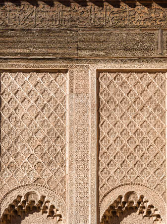 Ali ben Youssef Madrasa exterior islamic symbols, calligraphy and sacred geometry carved on the wall...