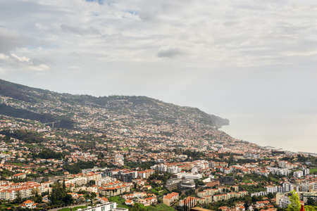 Cityscape of Funchal in cloudy rainy weather, Madeira Island, Portugalの写真素材