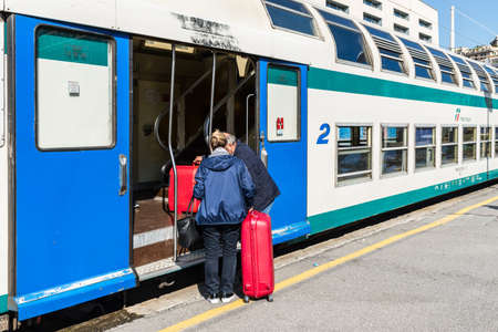 Genoa, Italy - May 15, 2017: Travelers are getting on the Trenitalia train at the Genova Brignole railway station in Genoa, Liguria, Italy.のeditorial素材