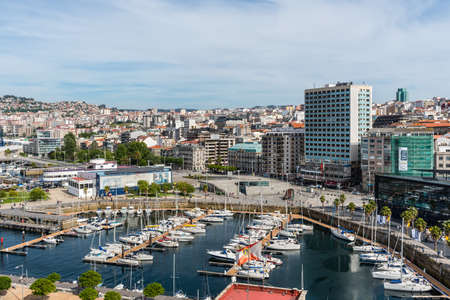 Vigo, Spain - May 20, 2017: Cityscape of Vigo with moored yachts in the foreground in port of Vigo, Galicia, Spain.のeditorial素材