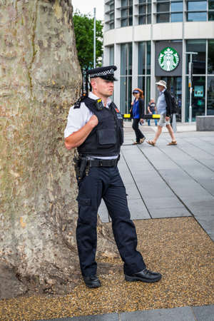 London, UK - May 23, 2017: Police officer oversee the public near Tower of London, UK.のeditorial素材