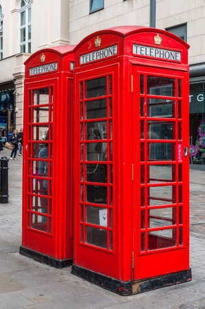 London, UK - May 23, 2017: Traditional old style UK red phone boxes (booths) in London, England, United Kingdom.のeditorial素材