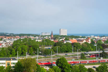 Rostock, Germany - May 26, 2017: View from the ship on the coast of Baltic Sea with the church tower...