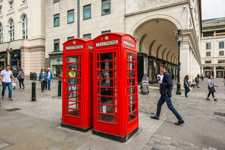 London, UK - May 23, 2017: Traditional old style UK red phone boxes (booths) in London, England, United Kingdom.のeditorial素材