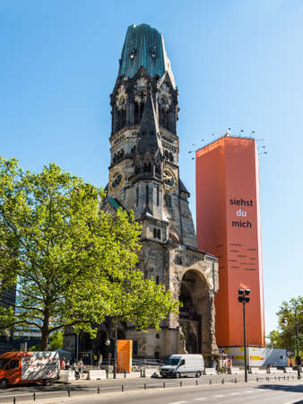 Berlin, Germany - May 27, 2017: Kaiser-Wilhelm-Kirche, broken spire and modern bell tower in Berlin, Germany. Damaged church tower is a symbol of Berlin's resolve to rebuild city after war.のeditorial素材