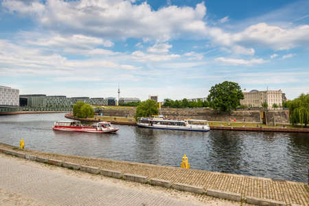 Berlin, Germany - May 28, 2017: Sightseeing boats on the river Spree in Berlin, Germany.