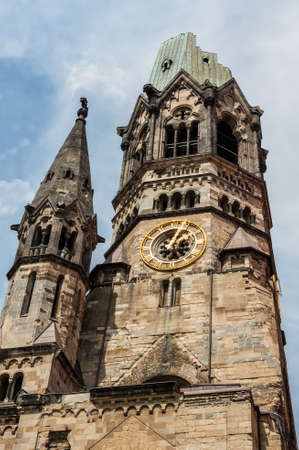 Berlin, Germany - May 27, 2017: Kaiser-Wilhelm-Kirche, broken spire and modern bell tower in Berlin, Germany. Damaged church tower is a symbol of Berlin's resolve to rebuild city after war.のeditorial素材