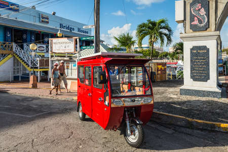 Bridgetown, Barbados - December 18, 2016: Local red taxi wait for passengers in Bridgetown, Barbados, West Indies, Caribbean, Central America.のeditorial素材