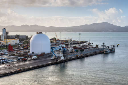 Fort-de-France, Martinique - December 19, 2016: Tanks and port infrastructure in the harbour of Martinique, Caribbean, Lesser Antilles. Martinique is an insular region of France. Fort-de-France is the capital of Martinique.のeditorial素材